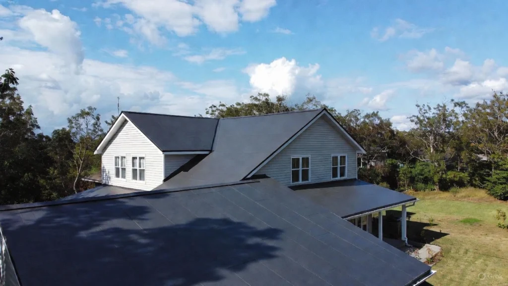 Wide view of a large PVC rubber roofing system installed on a commercial building, featuring the reflective white membrane and clean parapet walls.